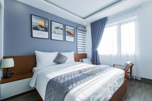 Voodi või voodid majutusasutuse Dang's Hotel toas
