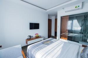Voodi või voodid majutusasutuse Dang's Hotel toas