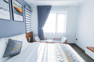 Voodi või voodid majutusasutuse Dang's Hotel toas