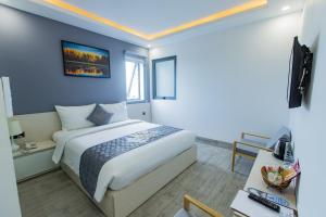 Voodi või voodid majutusasutuse Dang's Hotel toas