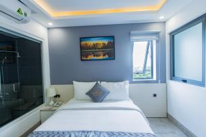 Voodi või voodid majutusasutuse Dang's Hotel toas