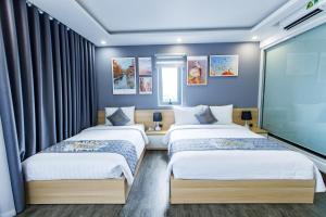 Voodi või voodid majutusasutuse Dang's Hotel toas