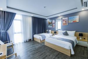 Voodi või voodid majutusasutuse Dang's Hotel toas