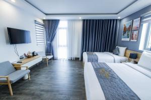 Voodi või voodid majutusasutuse Dang's Hotel toas
