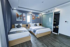 Voodi või voodid majutusasutuse Dang's Hotel toas