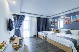 Voodi või voodid majutusasutuse Dang's Hotel toas