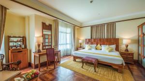 Postel nebo postele na pokoji v ubytování Sokha Angkor Resort