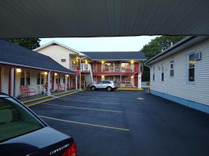 a car parked in a parking lot next to buildings at Maine Motel in South Portland