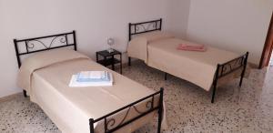 A bed or beds in a room at Civico 27 - In Terrazza