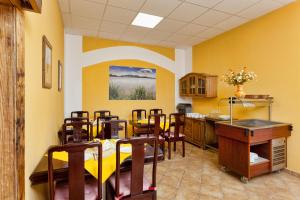 Reštaurácia alebo iné gastronomické zariadenie v ubytovaní In Vino Bed & Breakfast