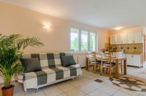 a living room with a couch and a table at Willa Rowy in Rowy