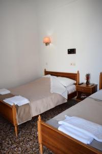Кровать или кровати в номере Oceanis Hotel