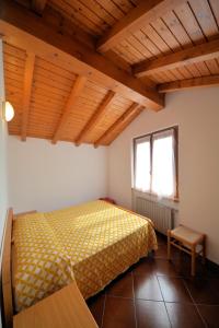 Ένα ή περισσότερα κρεβάτια σε δωμάτιο στο Agriturismo Runchee