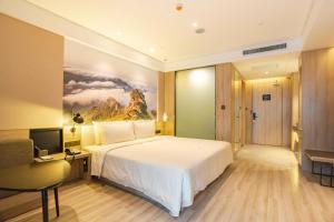Postel nebo postele na pokoji v ubytování Atour Hotel Xi'an Gaoxin Jinye Road Branch