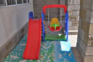 a play set with a slide on a playground at Panorama in Cholpon-Ata