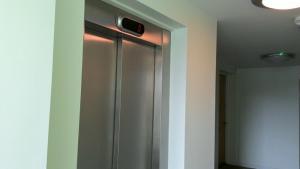 a stainless steel refrigerator in a room at holiday Apartment with two bathrooms, lift access in Edinburgh
