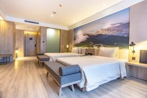 Postel nebo postele na pokoji v ubytování Atour Hotel Xi'an Gaoxin Jinye Road Branch