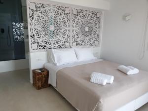 Postel nebo postele na pokoji v ubytování Bellou Suites