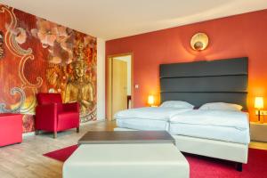 Postel nebo postele na pokoji v ubytování Hotel l'adresse garni