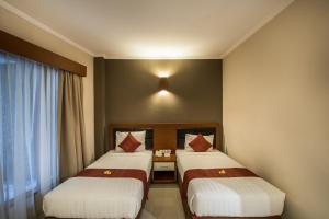 Postel nebo postele na pokoji v ubytování Svarna Hotel