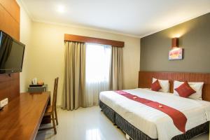 Postel nebo postele na pokoji v ubytování Svarna Hotel