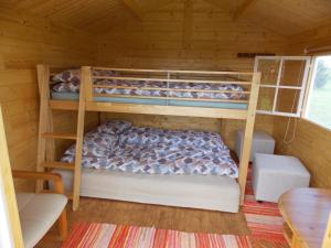 a bedroom with two bunk beds in a cabin at Kastani Camping in Haapsalu