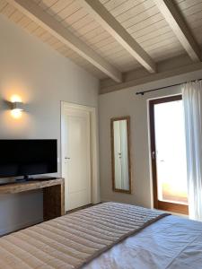 A bed or beds in a room at Borgo Al Tempo Perduto Még 37 kép