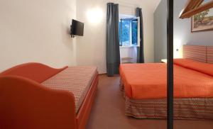 Letto o letti in una camera di Dimora Villa Serena Porto Selvaggio