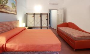 Letto o letti in una camera di Dimora Villa Serena Porto Selvaggio