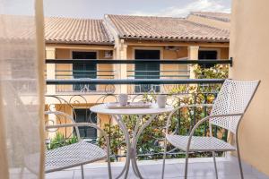 A balcony or terrace at OPERA BLUE Hotel Gouvia Corfu