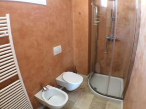 a bathroom with a shower and a toilet and a sink at Casa Nina in Gabicce Mare +36 photos
