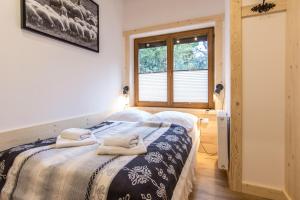 Posteľ alebo postele v izbe v ubytovaní Apartamenty Orkana Centrum Zakopane