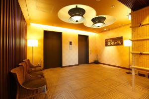 a large room with chairs and lights on the ceiling at Dormy Inn Premium Kyoto Ekimae Natural Hot Spring in Kyoto