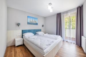 Posteľ alebo postele v izbe v ubytovaní Apartamenty Cypel Helski