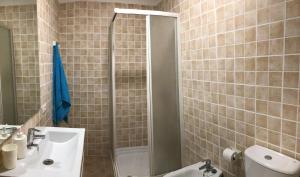 a bathroom with a shower and a sink at Charco Las Damas in Playa de San Juan +20 photos