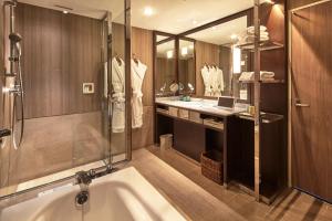 a large bathroom with a tub and a sink at The Prince Park Tower Tokyo - Preferred Hotels & Resorts, LVX Collection in Tokyo