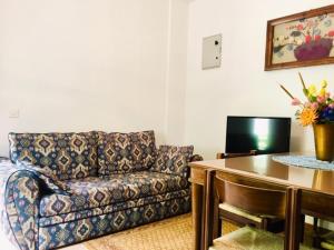 a living room with a couch and a table at Apartmaji Jana in Bovec