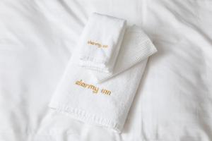 a pair of white socks with the words becoming an ordinary mum at Dormy Inn Premium Kyoto Ekimae Natural Hot Spring in Kyoto