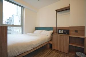 Voodi või voodid majutusasutuse Mia Casa Hotel toas