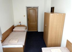 Postel nebo postele na pokoji v ubytování HOTEL STAŘÍČ