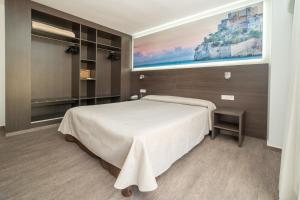 Postel nebo postele na pokoji v ubytování Hotel Prado II