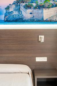 Postel nebo postele na pokoji v ubytování Hotel Prado II