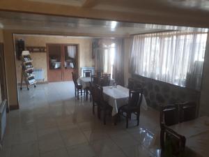 a dining room with a table and some chairs at Hotel VIVAS in Goris