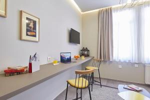 A television and/or entertainment centre at Old Athens style 1bdr with Acropolis view rooftop!
