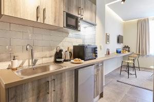 A kitchen or kitchenette at Old Athens style 1bdr with Acropolis view rooftop!