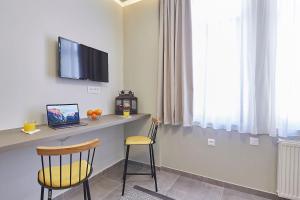 A television and/or entertainment centre at Old Athens style 1bdr with Acropolis view rooftop!