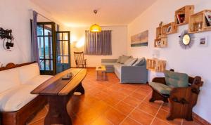 a living room with a couch and a table at Ionian Seaview apartments in Syvota