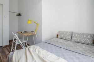 Łóżko lub łóżka w pokoju w obiekcie OhMyHome - Kościuszki