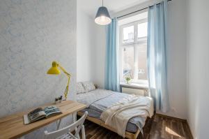 Łóżko lub łóżka w pokoju w obiekcie OhMyHome - Kościuszki