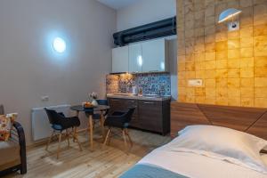 Postelja oz. postelje v sobi nastanitve Wine Inn Borjomi Aparthotel